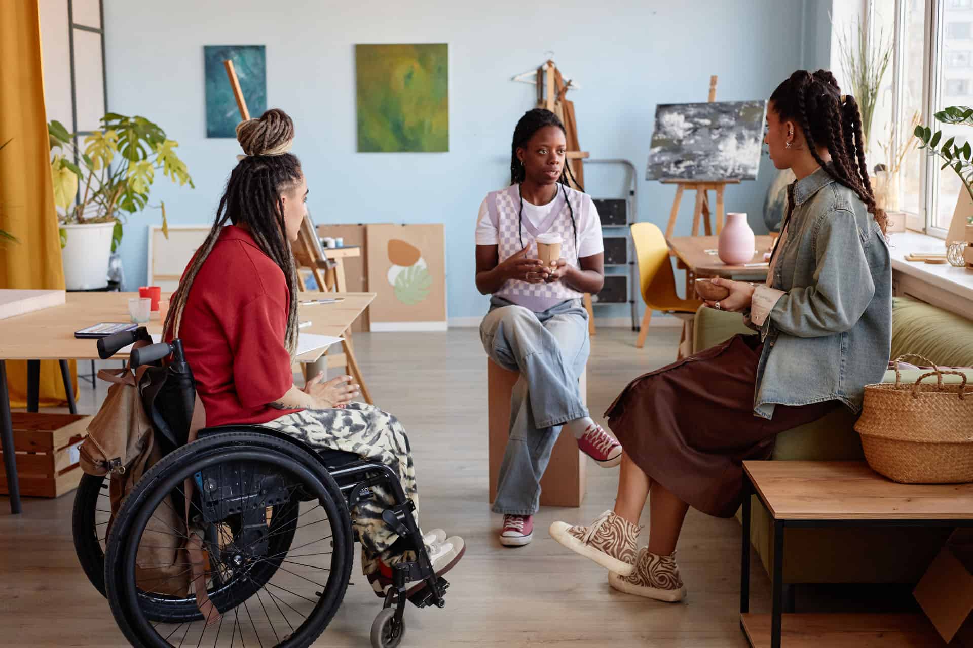 Individuals participating in a supportive day habilitation program setting.