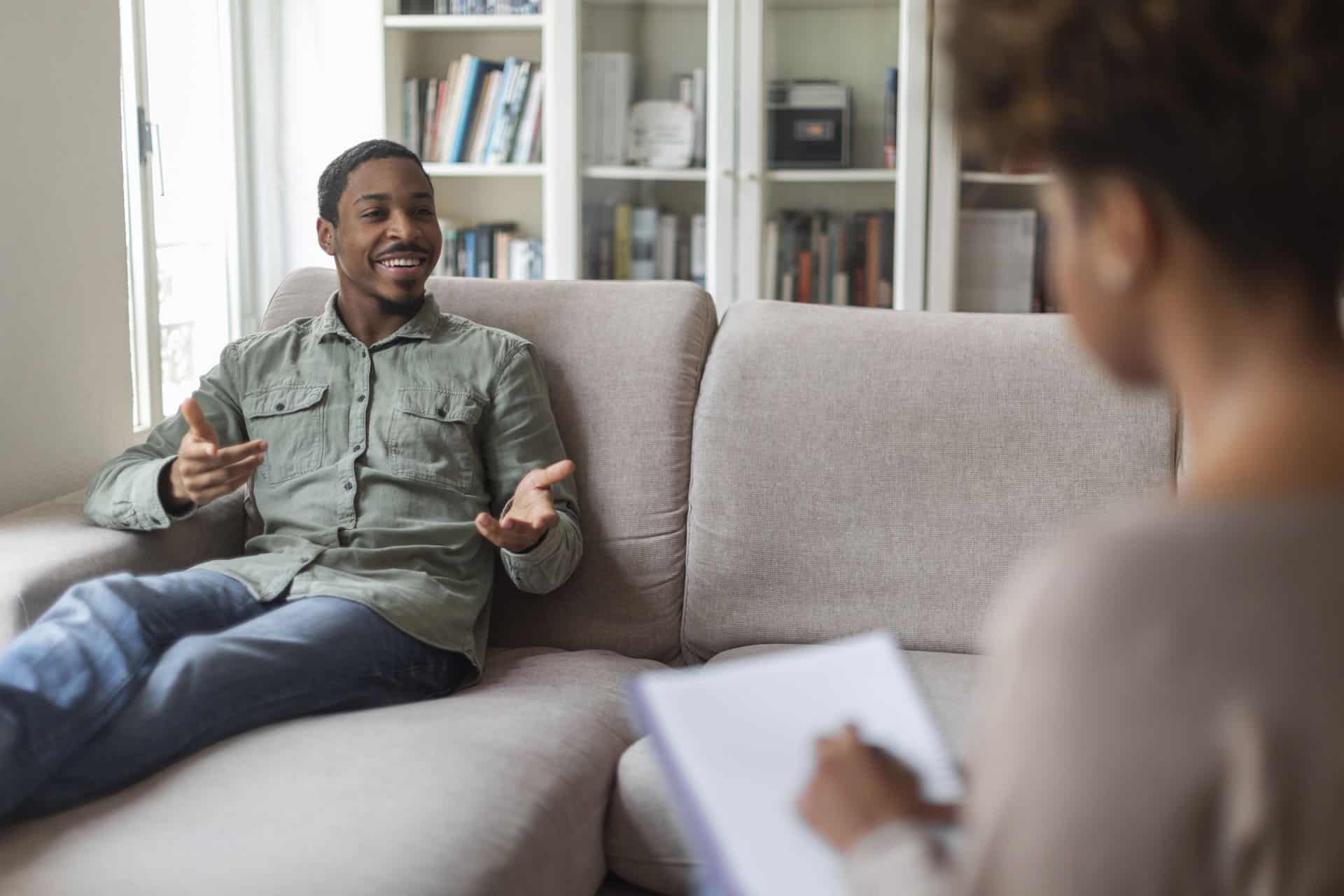 Adult client speaking with a clinician during a therapy or counseling session in Virginia.